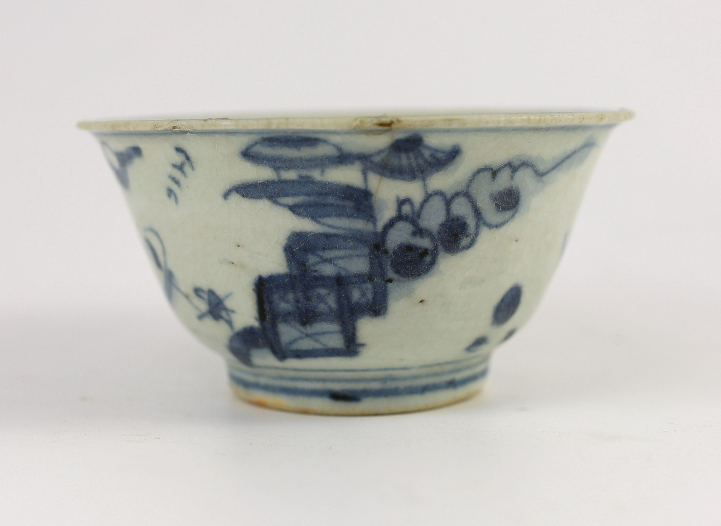 A Chinese Transitional inscribed blue and white bowl, mid 17th century, 12cm diameter, cracked